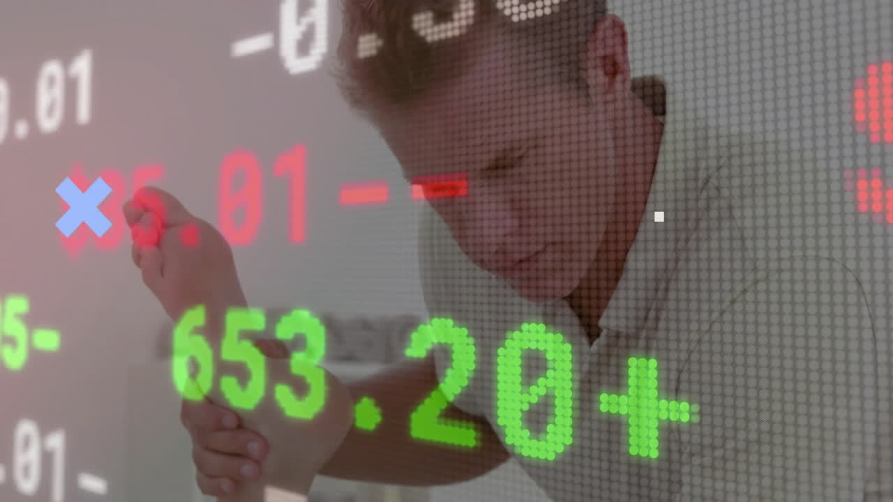 Male therapist massaging patient foot in finance context, showing floating red green stock numbers