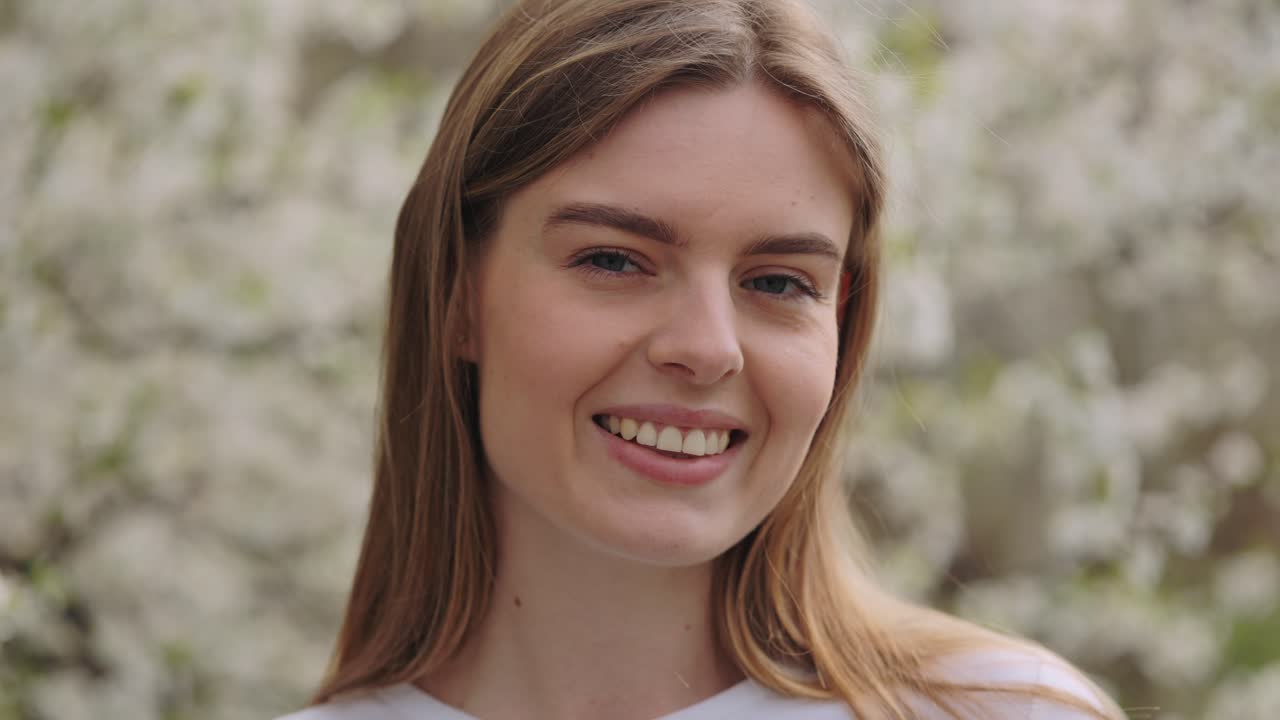 Smiling Woman in Spring Flowers