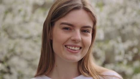 smiling woman in spring flowers