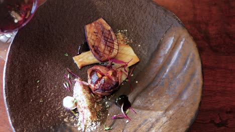 Top-down-view-of-aubergine,-mushroom---fig-fine-dining-with-red-wine