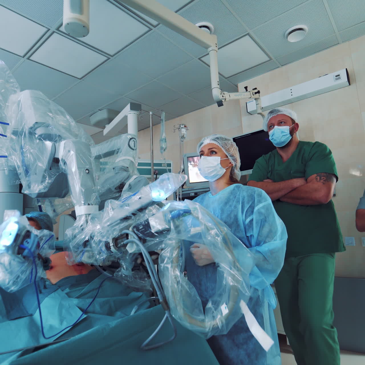 Medical robot. Robotic Surgery. Manipulators performing surgery on a man