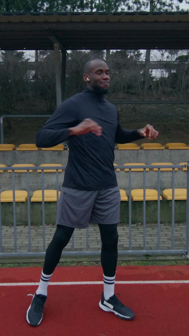 Man exercising outdoors on a track