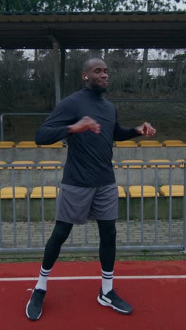 man exercising outdoors on a track