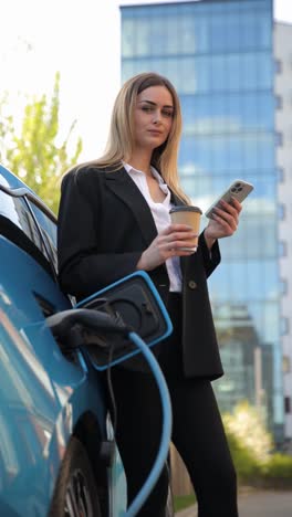 vertical video woman in a business suit is sitting on a wooden bench, talking on the phone. the scene suggests business communication and connection
