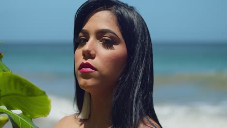 facial close up of a latin woman on a sunny day on the beach