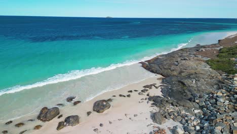 Descend-on-Cape-Leeuwin-coastline-in-Australia-with-luxury-empty-beach-and-turquoise-Indian-ocean-water