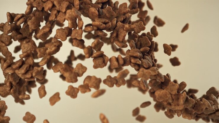 Chocolate Cereal Pieces Falling and Floating in Slow Motion
