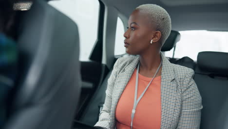businesswoman in car back seat