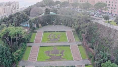 park in genoa with flowerbeds of sailing ships of christopher columbus