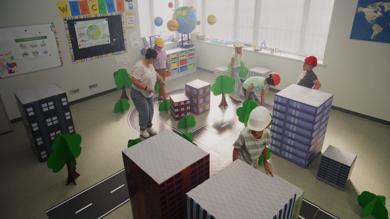 Smart Young Kids in Hardhats Creating Interactive Urban Planning
