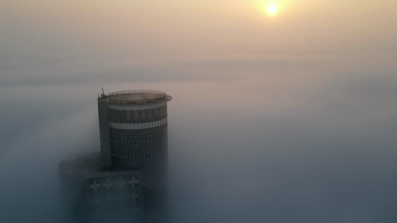 Tower Pierced Through Misty Sunrise