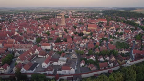 Nordlingen-old-town-centre,-drone-orbit-at-dawn