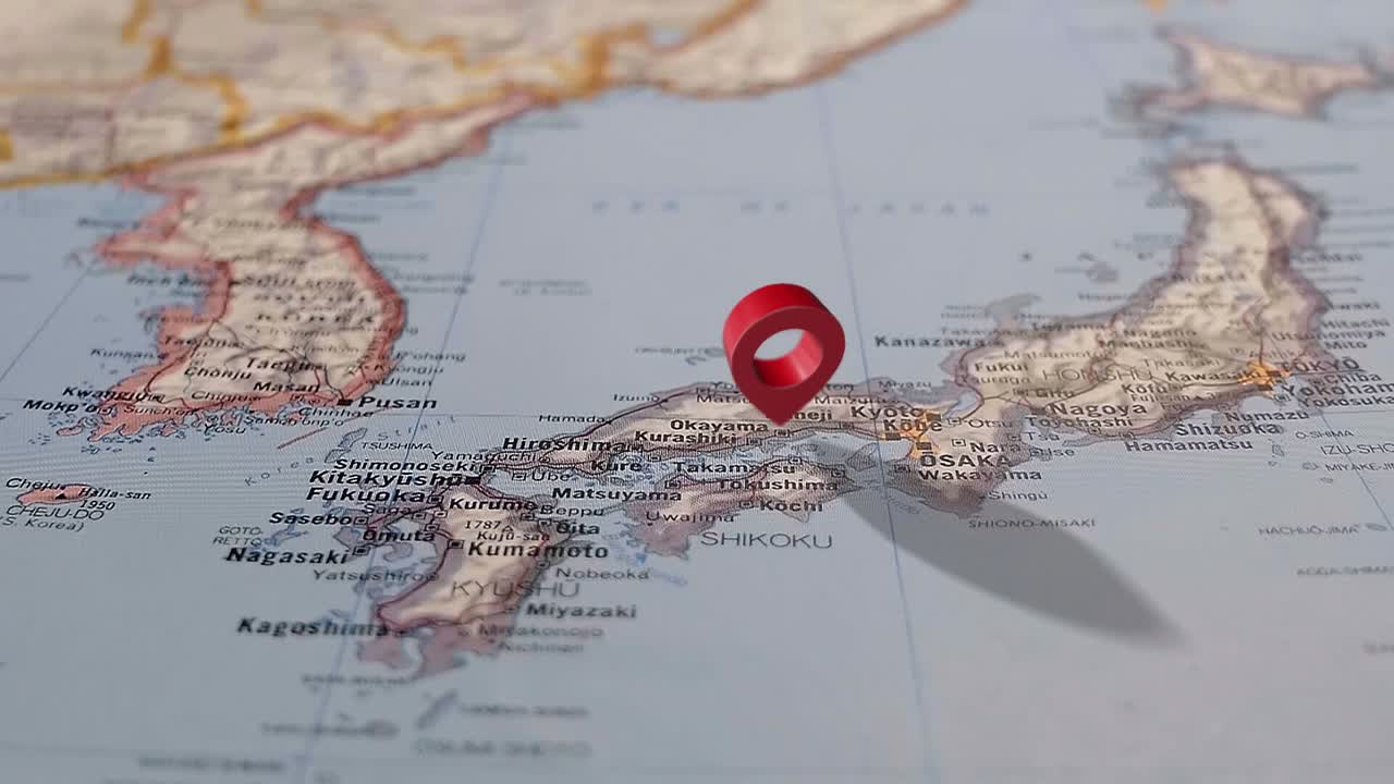 Slider Shot to Reveal Japan on a Printed Map With 3D Animated Map Marker