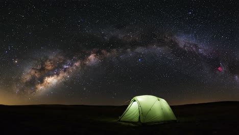 tent under the stars: an enchanting display of the milky way galaxy spanning the night sky in a stunning outdoor setting