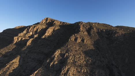 Aerial-drone-shot-of-the-mountains-of-the-National-Park-of-Peguin-in-Chihuahua-at-sunset