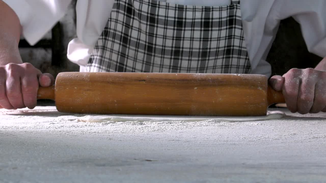 Rolling Out Dough with Flour to Make Turkish Pita