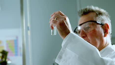 male scientist experimenting in laboratory 4k