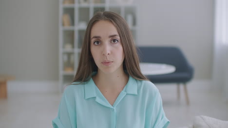 Head-shot-portrait-woman-looking-at-camera-makes-video-call.-Woman-in-front-of-a-computer-team-working-in-video-conference