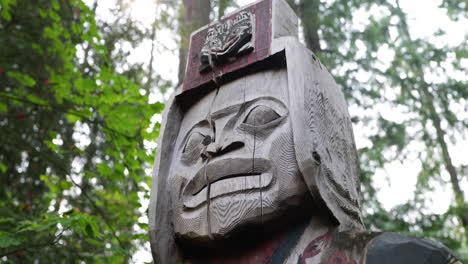 close up of totem pole in forest in 4k