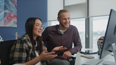 smiling woman explaining video call computer. colleagues presenting project