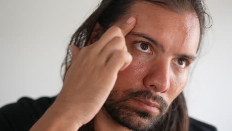 close-up portrait of a sweaty man