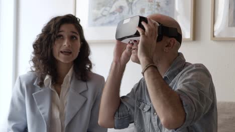 middle aged caucasian man wearing virtual reality headset