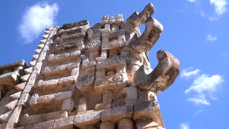 Many-Representations-Of-The-Face-Of-Chaac,-Mayan-God-Of-Rain,-Adorn-The-Exterior-Of-A-Temple-In-Mexico