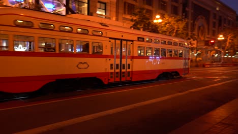 train passes by busy street