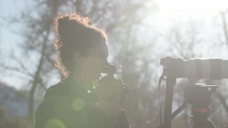 Woman-Photographer-Outside-in-Nature,-Female-Photographer-at-Sunset