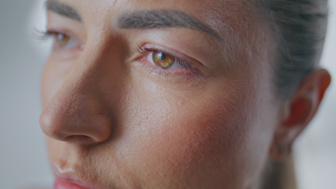 Relaxed face woman looking straight making breathing exercise at studio closeup