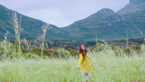 countryside, freedom and woman jumping in field