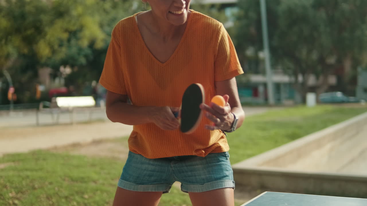 Mother and daughter playing board games in the park