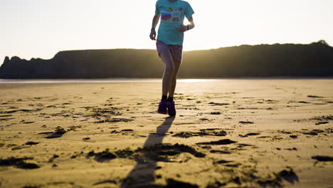 girl running on the beach at sunset