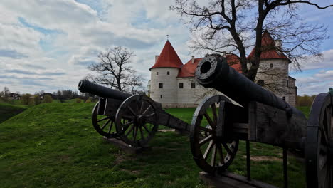 rustic cannons in front of bauska castle, latvia