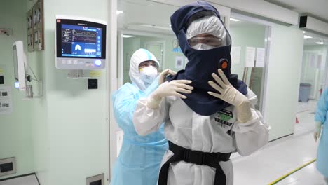 medic staffs putting on papr suits before entering covd-19 ward