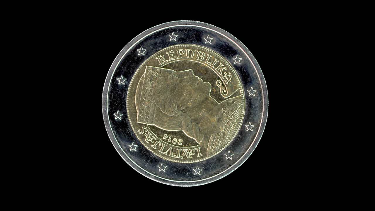 Latvia 2014 2 euro obverse with Latvian maiden design rotating on black background