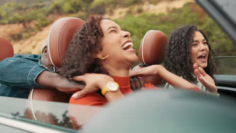 friends enjoying a fun road trip in a convertible