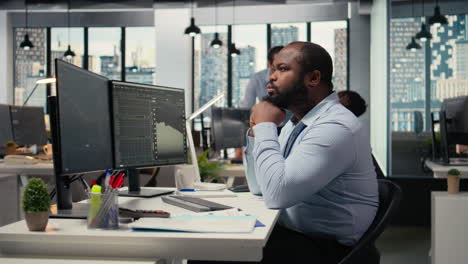 day trader analyzes stock market, doing thinking for buy and sell decisions