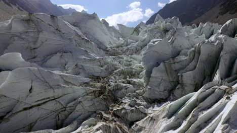 aerial shot of glacier at fairy meadows pakistan, cinematic slowly rising drone shot