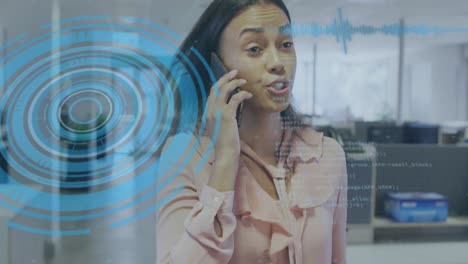 animation of data processing with scope scanning over biracial businesswoman