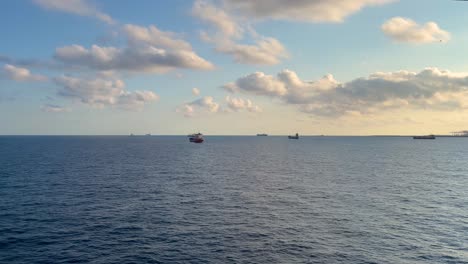 port of barcelona at sunset kay line towers and cranes loading container ships passenger ferry