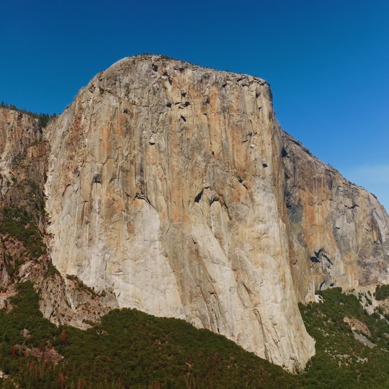 Vertical mountain formation in Yosemite National Park. The EL Capitan Rock in the rays of bright sun. Low angle view