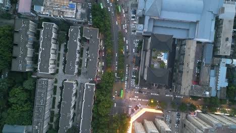 Bird-eye-aerial-drone-view-over-street-traffic-at-Datang-Everbright,-Xi’an,-large-city-and-capital-of-Shaanxi-Province-in-central-China