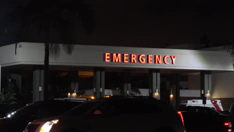 exterior wide shot hospital night  emergency sign night