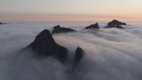 Aerial-view-of-Segla-mountain-above-the-sky,-Norway-during-summer