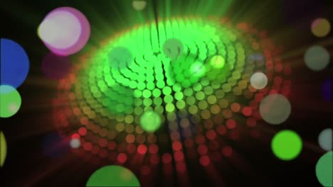 moving spots of coloured light and spotlights