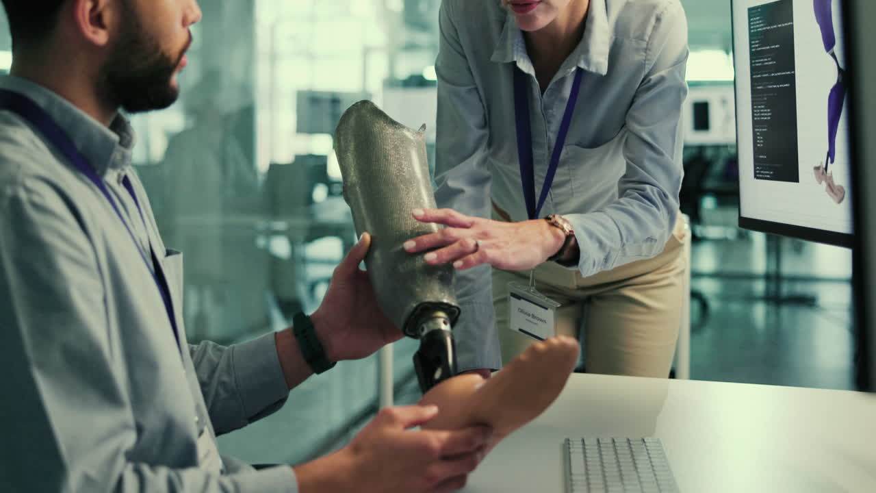 A team of engineers collaborate on the design of a prosthetic leg.