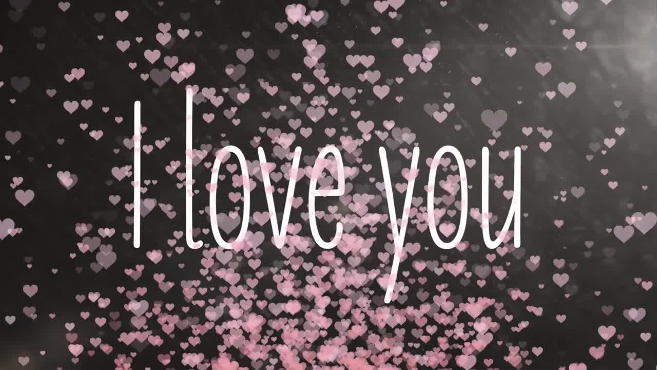 백색 문자로 "i love you"의 애니메이션 백색 분홍색 심장이 배경입니다.