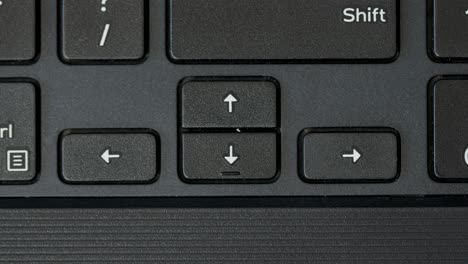 top view finger pushing arrow keyboard buttons