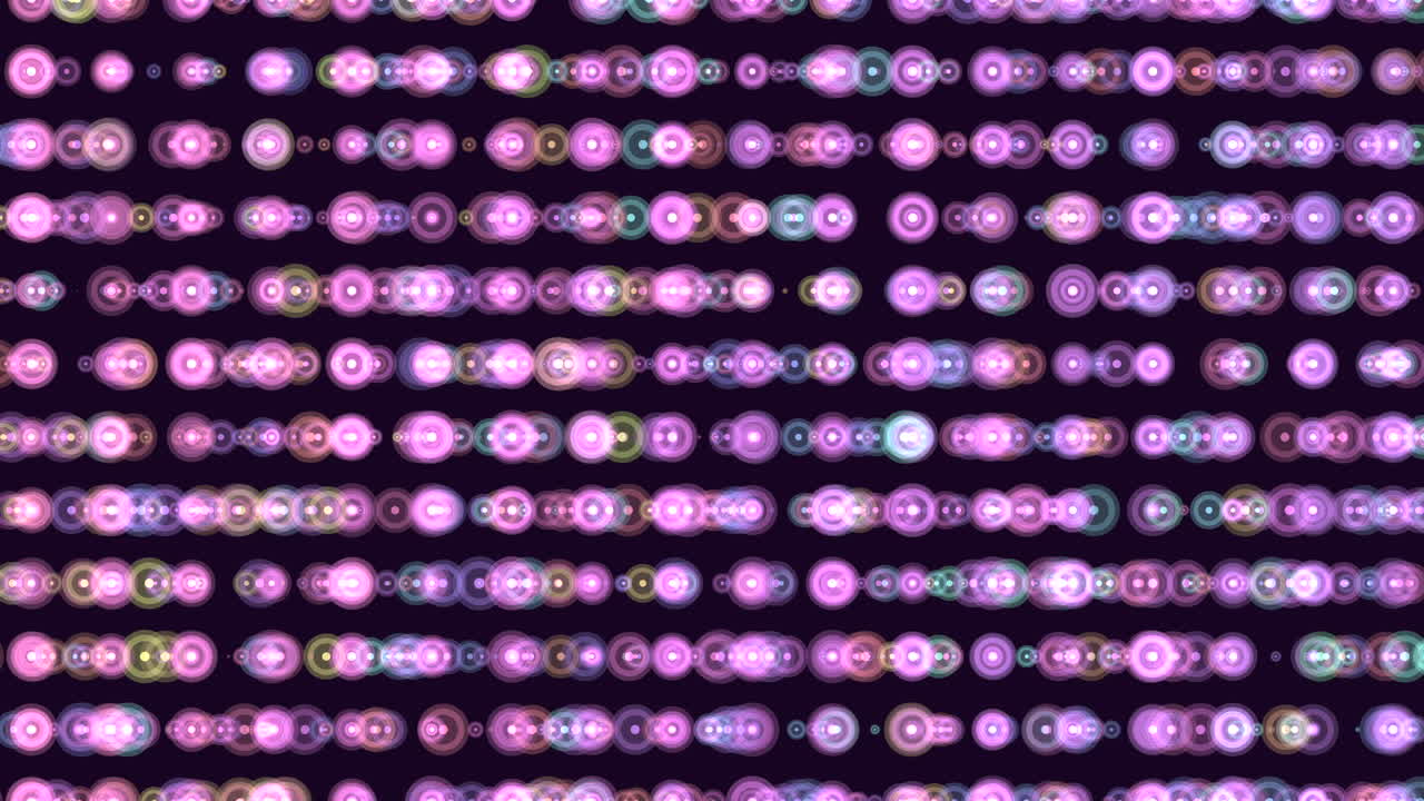 Symmetrical grid of colorful circles in shades of green, yellow, and blue